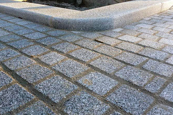 Kerb and cobblestone detail.